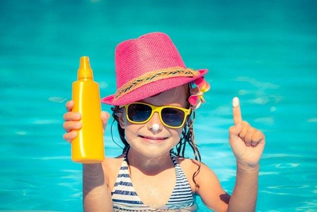 kid with sunscreen